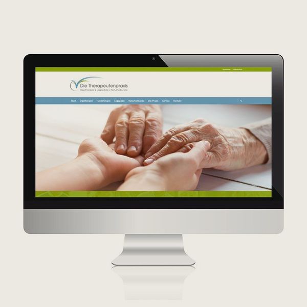 Website einer Therapeutenpraxis mit sich haltenden Händen im Monitor-Mockup